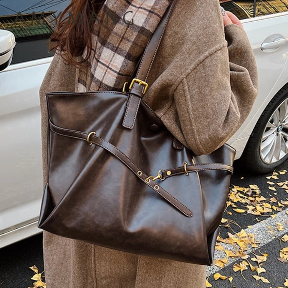 女性のヴィンテージ大容量 PU レザートートバッグメタルバックルストラップアクセントトップハンドルショルダーキャリーバッグ 2025 年冬
