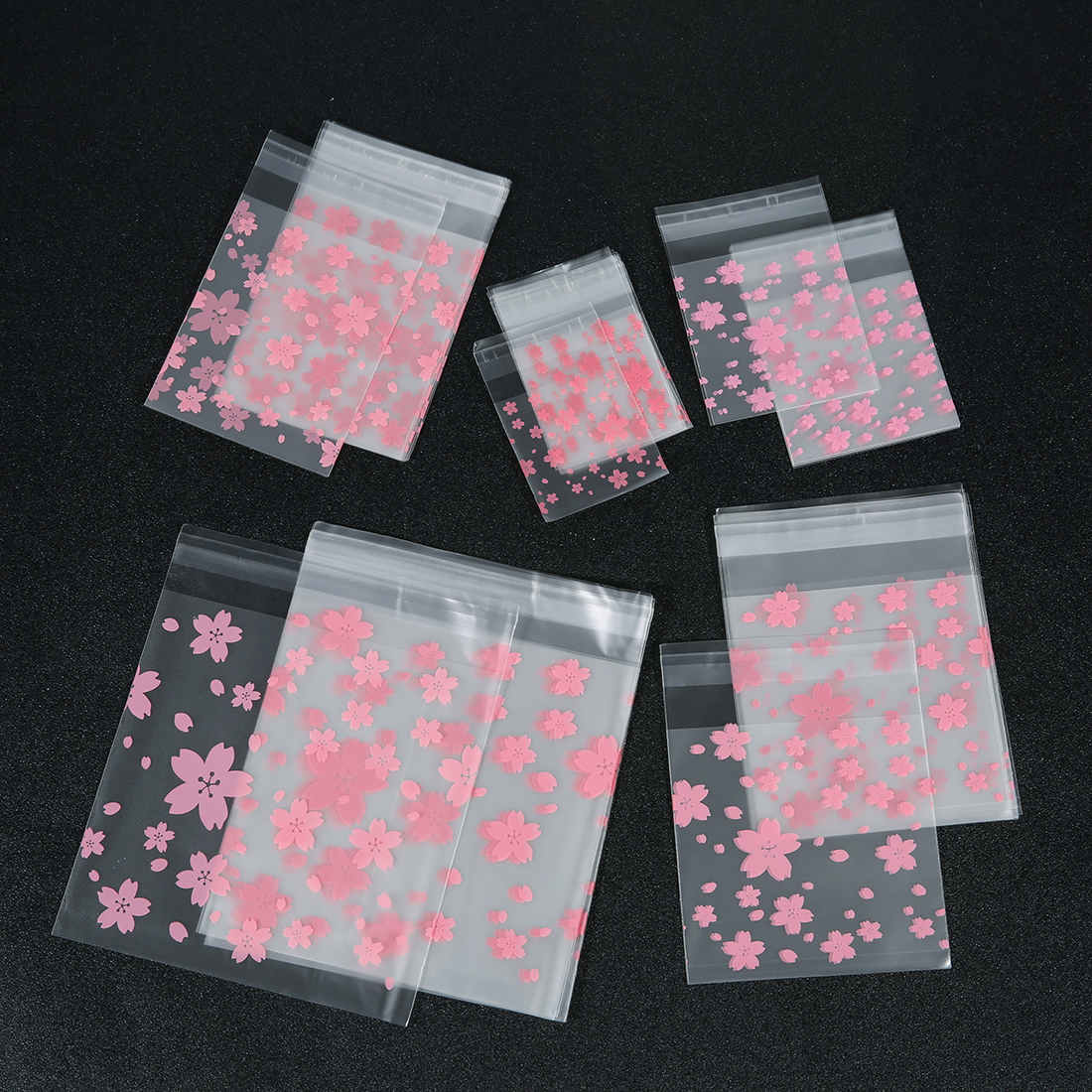 100 ピース/ロットさくら透明セルフシール袋ピンクの花柄ビニール袋キャンディークッキー保存袋ジュエリー包装袋