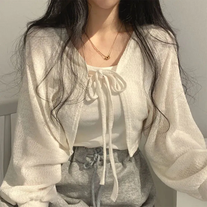 白ニットカーディガン女性の夏の薄い日焼け止めレースアップニットトップス女性のファッション韓国ランタンスリーブショートコート
