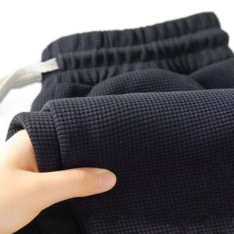 メンズレトロニットワッフルスウェットパンツ、伸縮性ウエストとドローストリング付きのルーズストレートレッグソリッドカラーパンツ、秋に最適