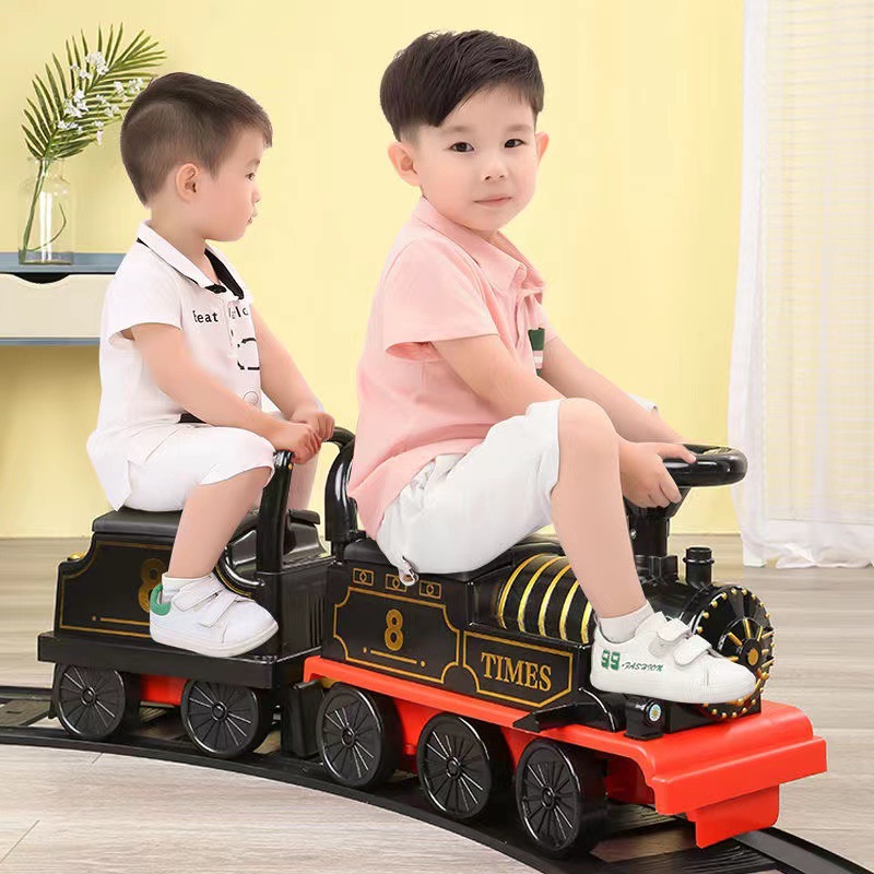 乗って線路おもちゃの電車電気自動車子供ベビーウォーカーベビーカーのおもちゃベビーライド 1 年間電気自動車のおもちゃ幼児