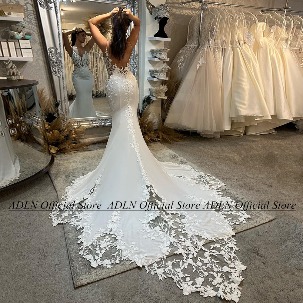 セクシーなマーメイドのウェディングドレスカスタマイズされたスパゲッティストラップ V ネックシースルーアップリケオープンバックロングトレイン女性の花嫁のブライダルドレス