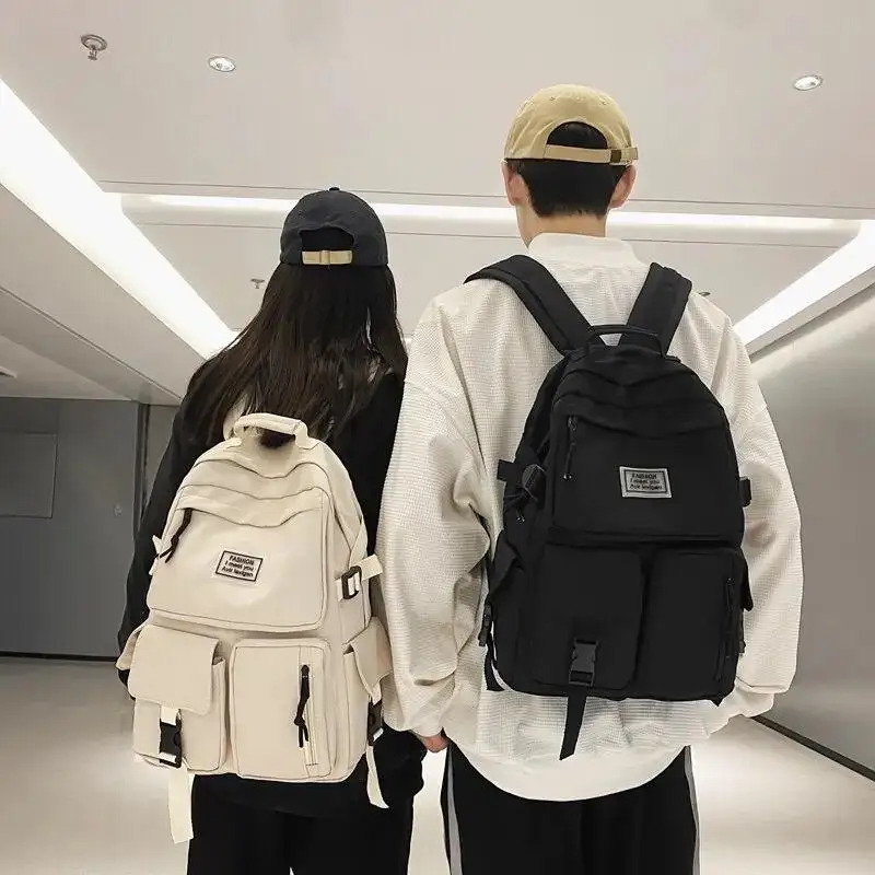 男性と女性の大容量カジュアルスクールバッグユニバーサルナイロンバックパックファッションコンピュータバックパック毎日の通勤