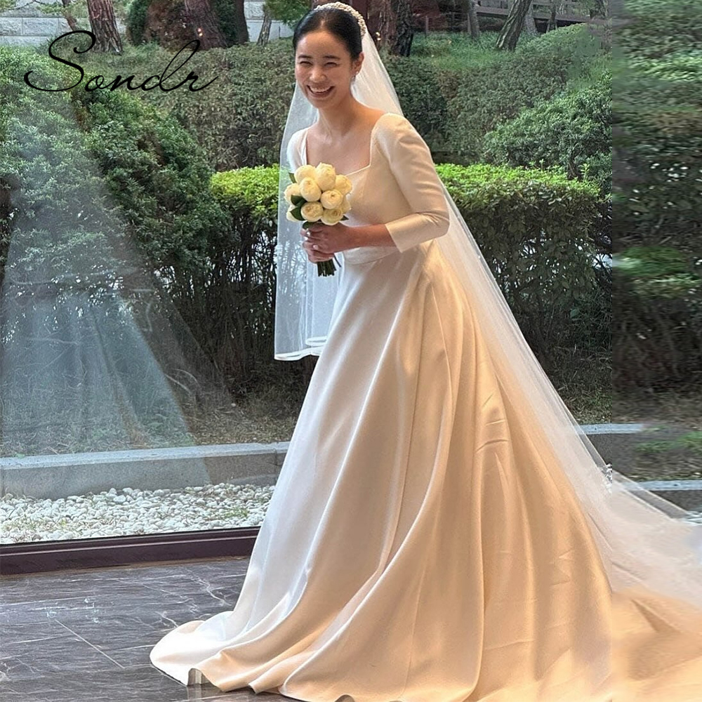 Sondr サテン長袖韓国のウェディングドレストレーンカスタマイズされた A ラインスクエアカラーブライダルガウンボタン自己ウェディングドレス