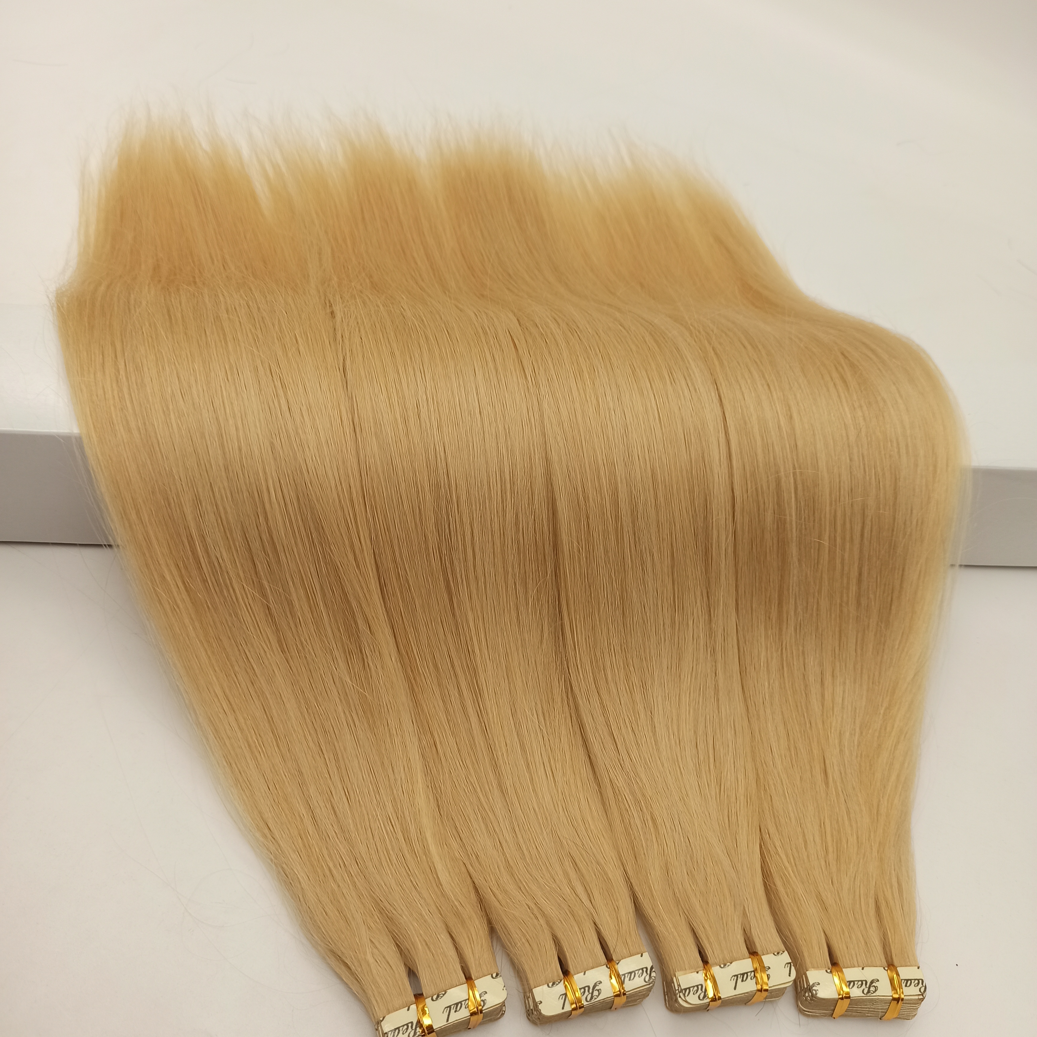 安い工場価格二重描画カスタマイズ色長さ 100% 人間テープヘアエクステンションバージンレミーテープヘアエクステンション
