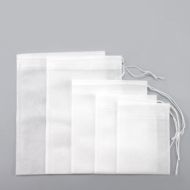 100 ピース/ロット 5 × 7 7 × 9 8 × 10 10 × 12 10 × 15 12 × 16 センチメートル巾着ティーバッグ不織布防水収納整理ポーチフィルターバッグ