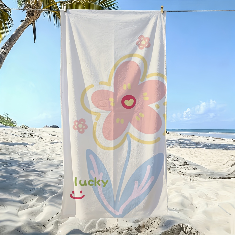 2D フラット、ピンクの花のイラスト、ラッキー テキストとジョイフル フェイス ビーチ タオル 1 枚、柔らかく肌に優しい、抜け落ちない、簡単に使用できます。