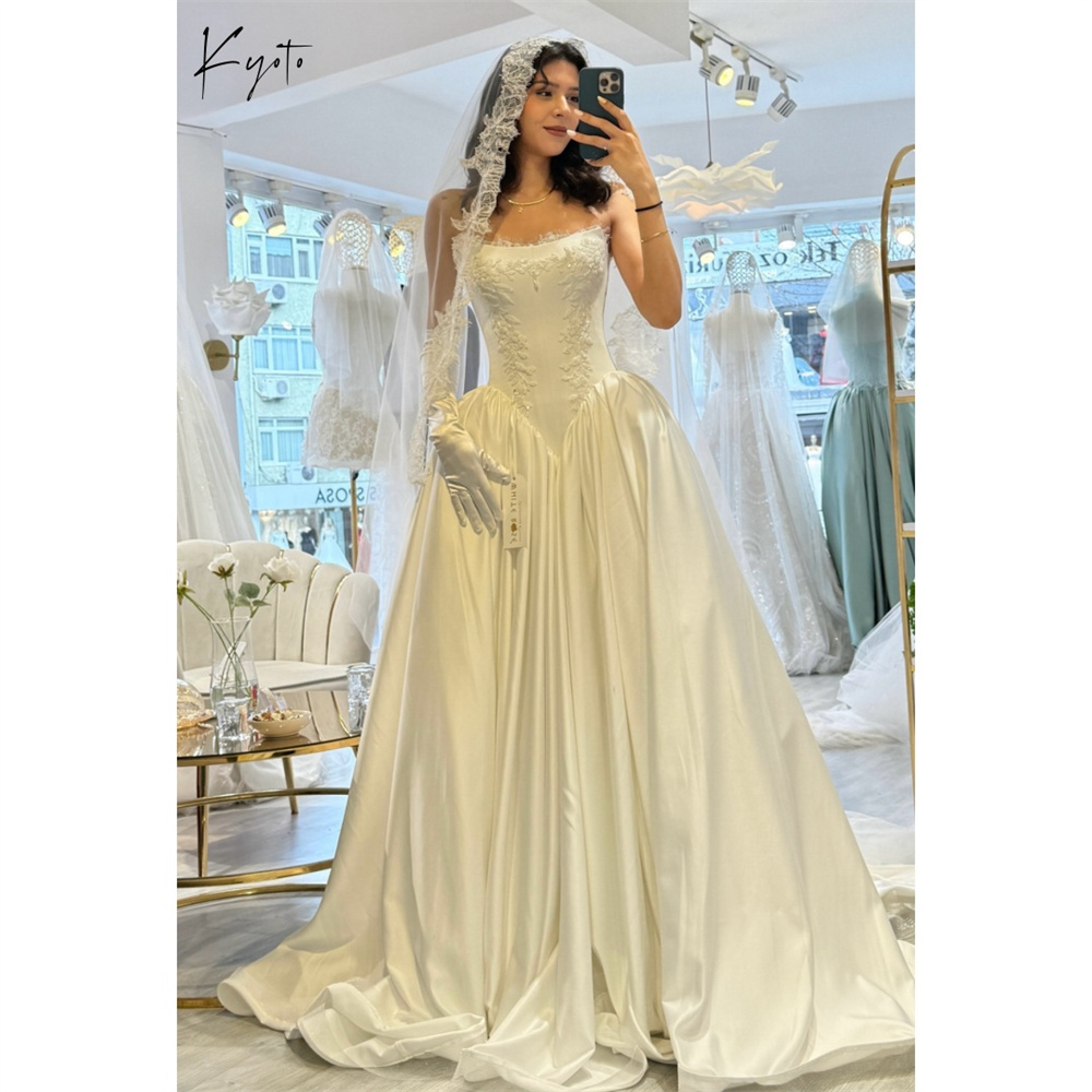 京都カスタマイズされた白いノースリーブのウェディングドレスストラップレスサテンコートトレインvestidos de nocheエレガントなaラインローブデマリー2026